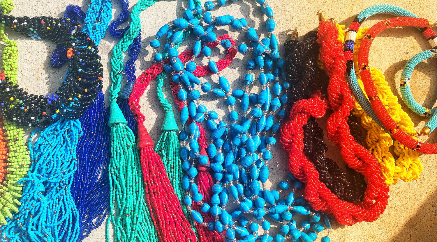 This collection includes Fair Trade hand made necklaces in many different styles.  You will find paper beads in multi and solid colors.  There are also various styles of seed bead necklaces in several designs and colors.