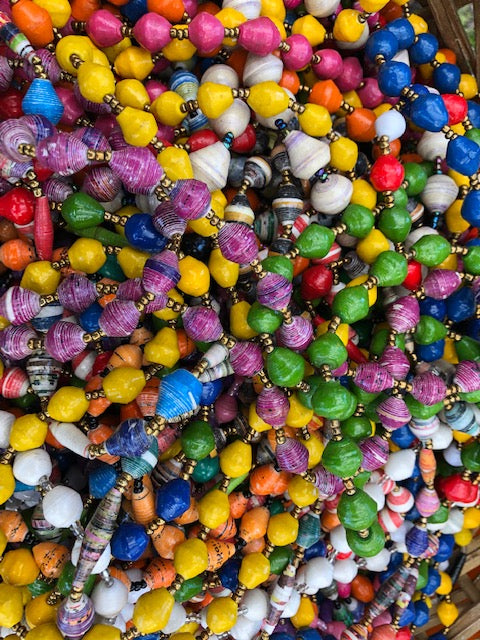 Hand made colorful medium length multicolor necklace made from magazines with accent seed beads in between. Each bead is hand rolled. Stylish and fashionable for casual or dressy. Fair trade.  Approximately 18" L