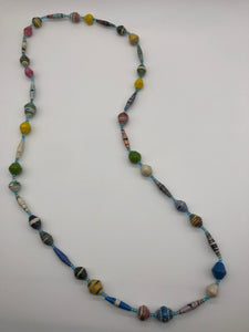 Hand made colorful medium length multicolor necklace made from magazines with accent seed beads in between. Each bead is hand rolled. Stylish and fashionable for casual or dressy. Fair trade.  Approximately 18" L