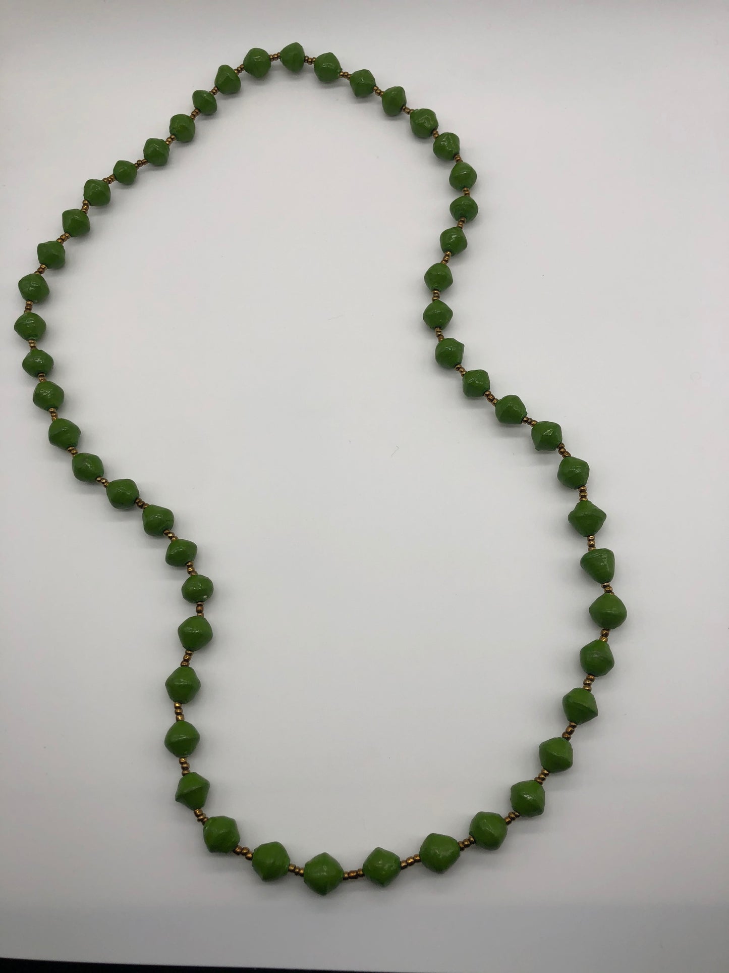 Hand made colorful medium length multicolor necklace made from magazines with accent seed beads in between. Each bead is hand rolled. Stylish and fashionable for casual or dressy. Fair trade.  Approximately 18" L