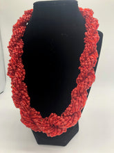 Load image into Gallery viewer, Stand out in style with this beautiful hand made braided style beaded necklace.  Approximately 18&quot; end to end.   The Dorcas necklace is named after one of our ladies whose photo you will find within this collection. Red