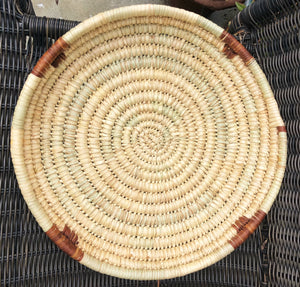 Handwoven fair trade sturdy African tray basket made from papyrus reed grown in Kenya. Natural color 15" round basket