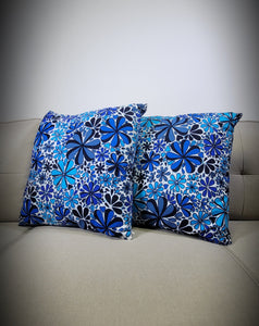 Blue floral print pillow multiple size flowers of different shades of blue