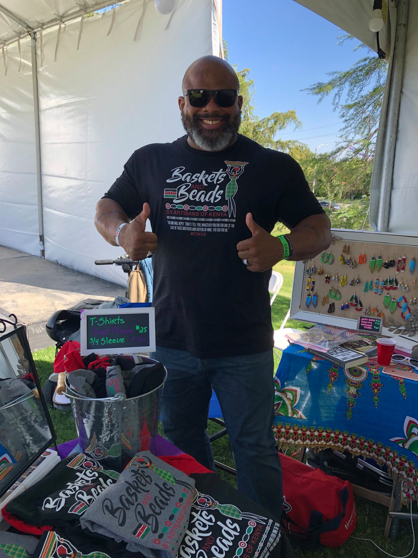 Baskets and Beads unisex short sleeve t-shirt worn by man