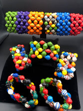 Load image into Gallery viewer, Handmade colorful bracelets made from magazines with accent seed beads in between. Each bead is hand rolled. Stylish and fashionable for casual or dressy. Fair trade.  Stretch and memory wrap bracelets and single strand.   The Patricia Collection is named after one of our ladies whose photo you will find within this collection. 