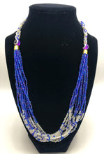 Load image into Gallery viewer, The Dinah necklace is named after one of our ladies whose photo you will find within this collection. The Dinah is a Fair trade hand crafted colorful seed bead necklace.  It is very delicate and classy.  Each necklace contains braided beads at top flowing into colorful hanging beads on the bottom. Each necklaces had solid color beads which are combined with colorful accent bead embellishment.     Slip over neck or easy open/close.