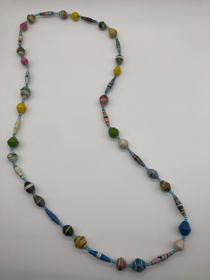 Hand made colorful medium length multicolor necklace made from magazines with accent seed beads in between. Each bead is hand rolled. Stylish and fashionable for casual or dressy. Fair trade.  Approximately 18