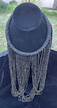 Load image into Gallery viewer, Black necklace hanging on bust. Chocker with long strands of black beads hanging down and looping back to connect to choker.