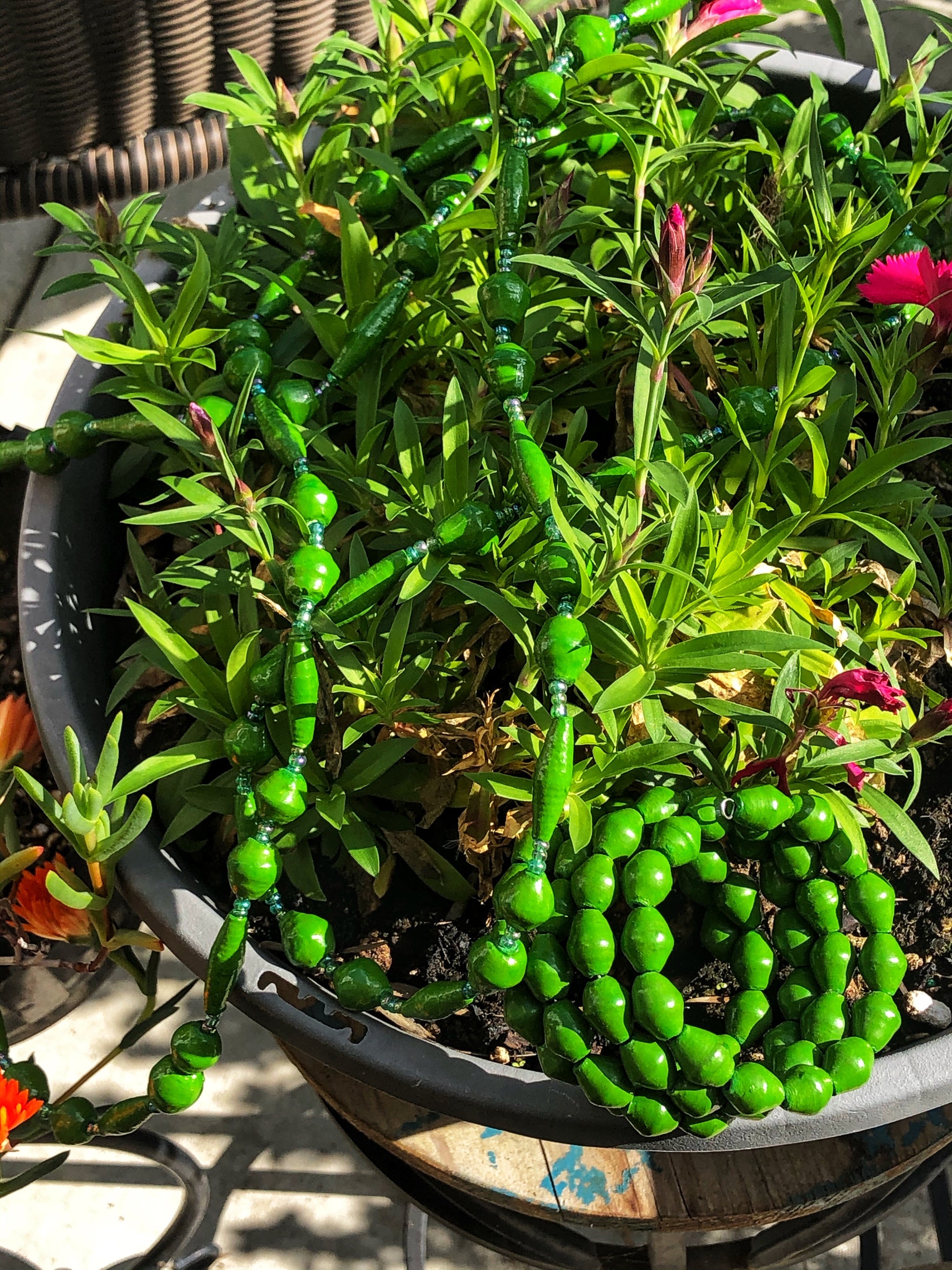 Long handmade paper bead necklace and memory wrap bracelet set green color. Necklace is approximately 30” long and usually worn doubled. Bracelet is a wrap bracelet. Handcrafted from magazines. Fair trade. Color: Green memory wrap bracelet and necklace pictured.