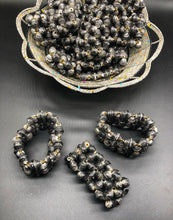 Load image into Gallery viewer, Hand crafted faded/weathered black paper bead stretch bracelet made from magazines and each bead individually rolled by hand.  Stylish and Fashionable for casual or dressy. Fair trade.