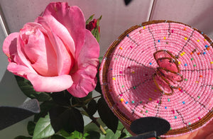Fair Trade hand crafted basket made from seed beads. Round shape with lid. These baskets take 1 full day to create.  Rich Pink 