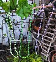 Load image into Gallery viewer, Handmade long length multicolor necklace made from magazines with accent seed beads in between. Each bead is hand rolled. green and white green and purple and white pictured
