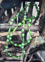 Load image into Gallery viewer, Handmade long length multicolor necklace made from magazines with accent seed beads in between. Each bead is hand rolled. Weathered green pictured