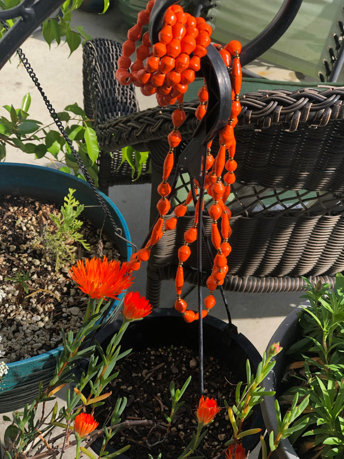 Long handmade paper bead necklace and memory wrap bracelet set orange color. Necklace is approximately 30” long and usually worn doubled. Bracelet is a wrap bracelet. Handcrafted from magazines. Fair trade.   Color Orange necklace and wrap bracelet pictured.