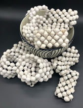 Load image into Gallery viewer, Hand crafted solid white wrap bracelet and solid white stretch bracelets with black, silver or gold bead embellishment Each bead individually rolled by hand from magazines.  Stylish and fashionable for casual or dressy. Fair trade.  