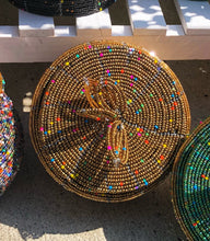 Load image into Gallery viewer, Fair Trade hand crafted basket made from seed beads. Round shape with lid. These baskets take 1 full day to create. Gold with multi color bead accent. 
