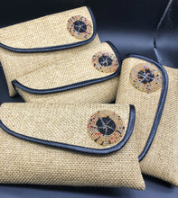 Load image into Gallery viewer, 4 beige clutches leaning on one another in a row, round beads on flap, black piping lines flap edge