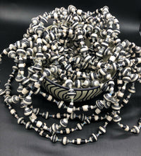 Load image into Gallery viewer, Hand crafted black and white paper bead necklace approximately 30” long with clear bead embellishment. Usually worn doubled. Each bead individually rolled by hand from magazines.  Stylish and Fashionable for casual or dressy. Fair trade.  